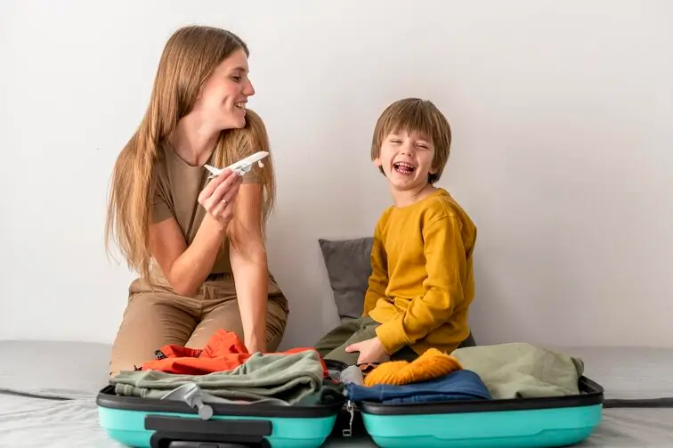 Travels with baby tips - happy family at airport ready for adventure with infant